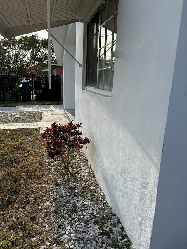 1167 NE 111th St, Miami, FL 33161 - view of home's exterior featuring stucco siding and fence