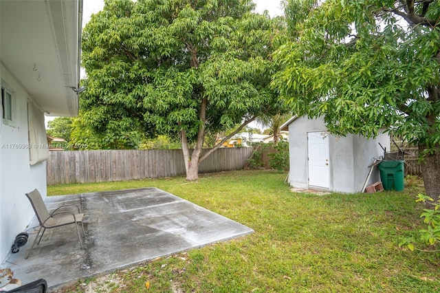 1167 NE 111th St, Miami, FL 33161 - view of yard featuring a patio, an outbuilding, a fenced backyard, and a shed