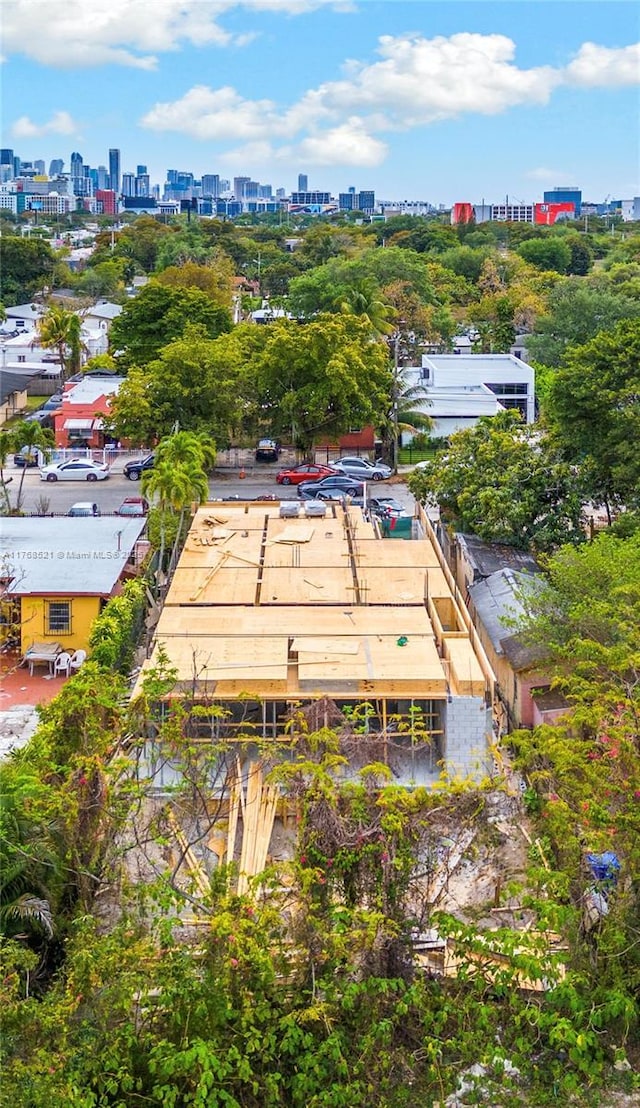 birds eye view of property with a view of city