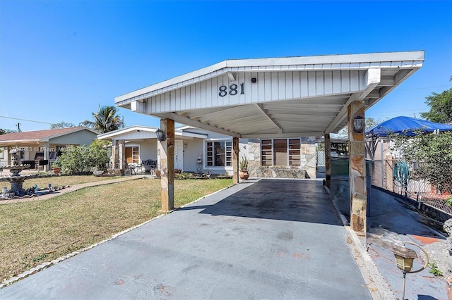 881 Hialeah Dr, Hialeah, FL 33010 - view of front of home with driveway and an attached carport