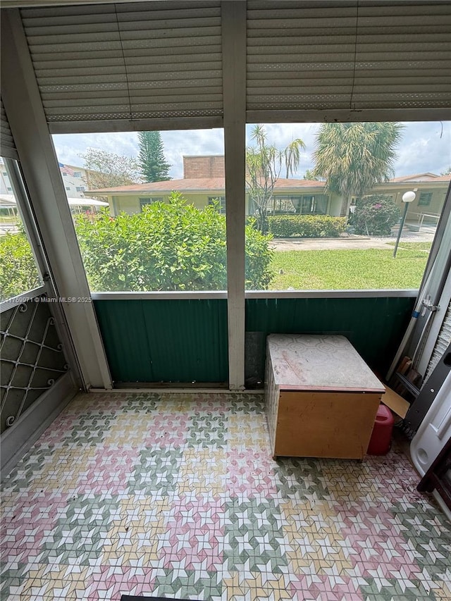 unfurnished sunroom featuring a wealth of natural light