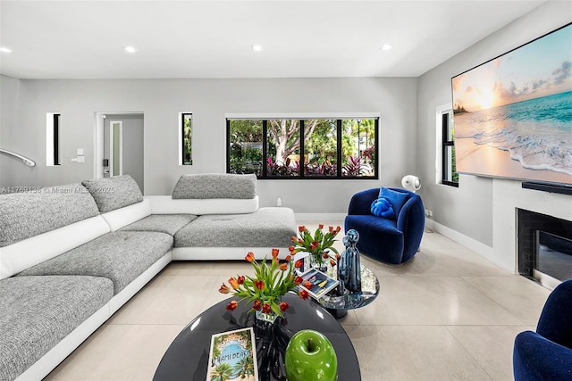 6166 Pine Tree Dr, Miami Beach, FL 33140 - living room featuring recessed lighting, a glass covered fireplace, and concrete floors