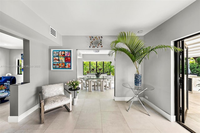 kitchen featuring white microwave, modern cabinets, white cabinets, stainless steel refrigerator with ice dispenser, and decorative backsplash