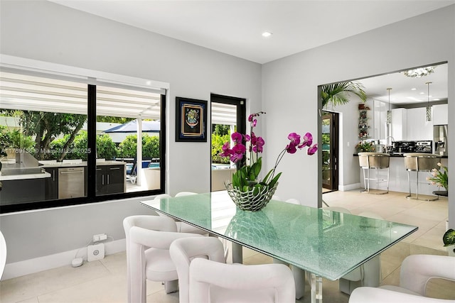 6166 Pine Tree Dr, Miami Beach, FL 33140 - dining space featuring light tile patterned floors and recessed lighting