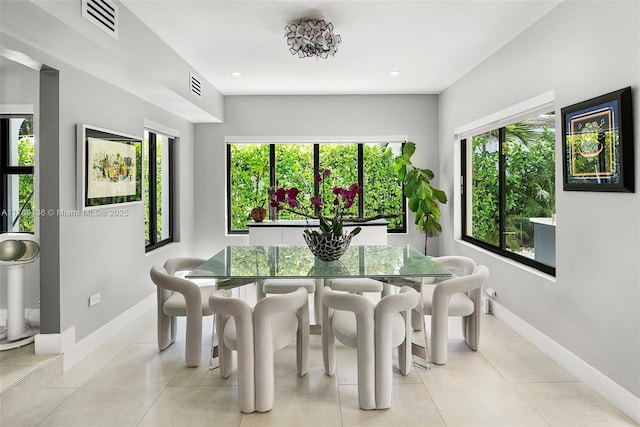 kitchen with backsplash, a sink, white cabinetry, and stainless steel appliances