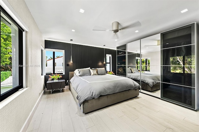 6166 Pine Tree Dr, Miami Beach, FL 33140 - bedroom with wood finished floors and a ceiling fan