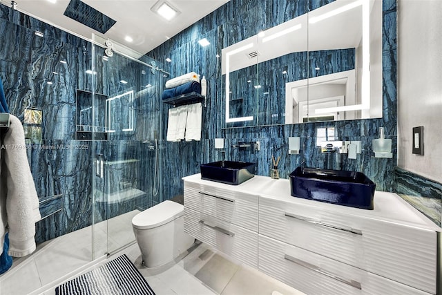 bathroom with a stall shower, vanity, baseboards, and plenty of natural light