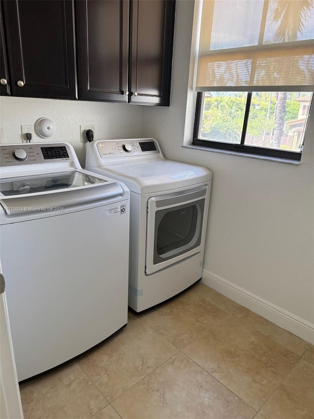 10086 NW 89th Ter, Doral, FL 33178 - washroom featuring baseboards, cabinet space, and washer and dryer