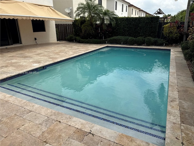 10086 NW 89th Ter, Doral, FL 33178 - view of pool featuring a patio, a fenced in pool, and a fenced backyard