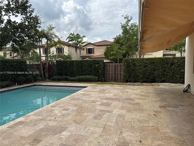 10086 NW 89th Ter, Doral, FL 33178 - view of swimming pool featuring a patio, a fenced in pool, and a fenced backyard