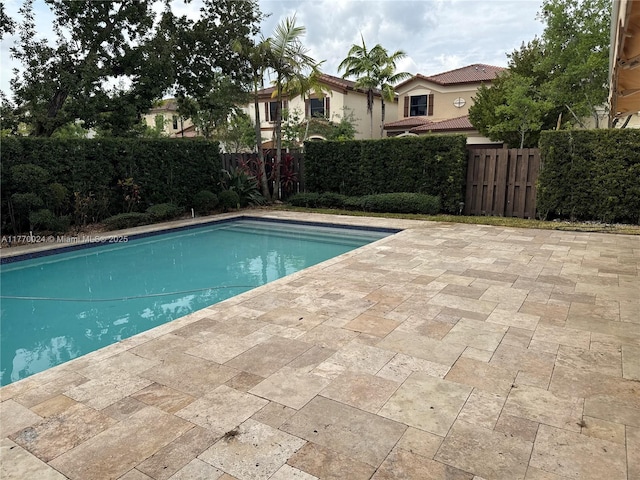 10086 NW 89th Ter, Doral, FL 33178 - view of swimming pool with a fenced backyard, a fenced in pool, and a patio area