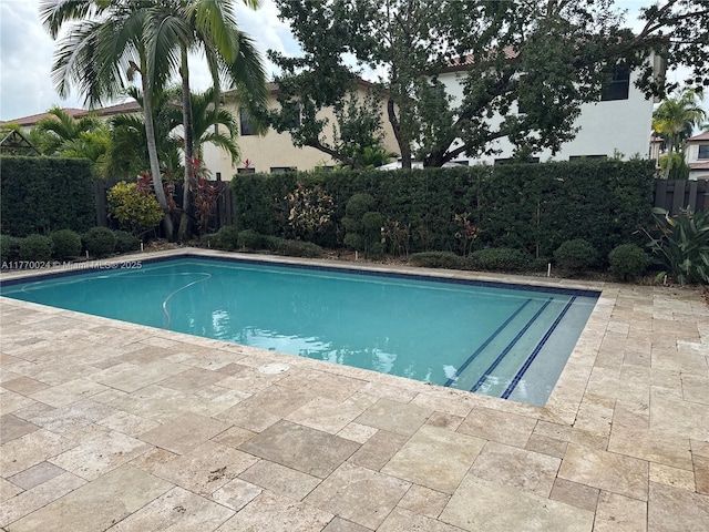 10086 NW 89th Ter, Doral, FL 33178 - view of pool featuring a fenced backyard, a fenced in pool, and a patio