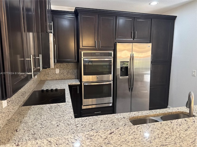 10086 NW 89th Ter, Doral, FL 33178 - kitchen with a sink, light stone counters, and appliances with stainless steel finishes