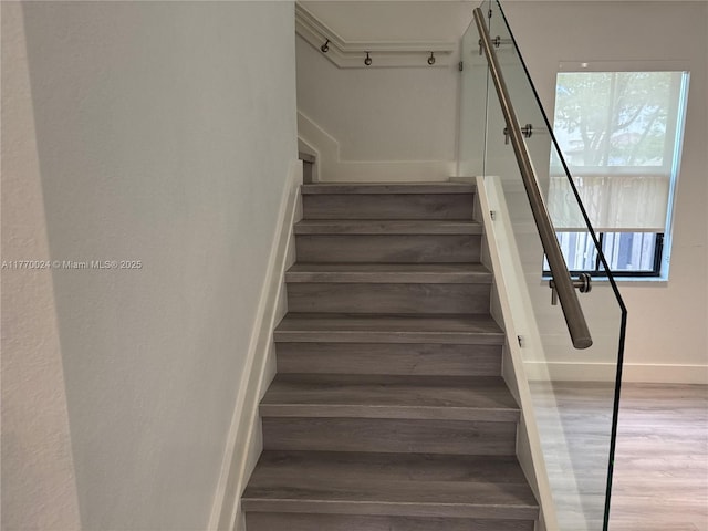 10086 NW 89th Ter, Doral, FL 33178 - staircase featuring baseboards and wood finished floors