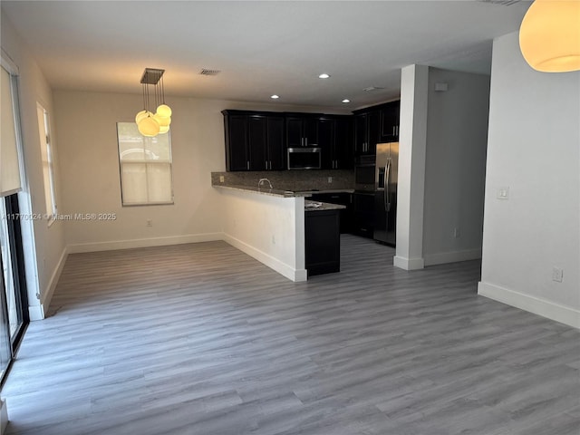 10086 NW 89th Ter, Doral, FL 33178 - kitchen with open floor plan, visible vents, dark cabinets, and appliances with stainless steel finishes