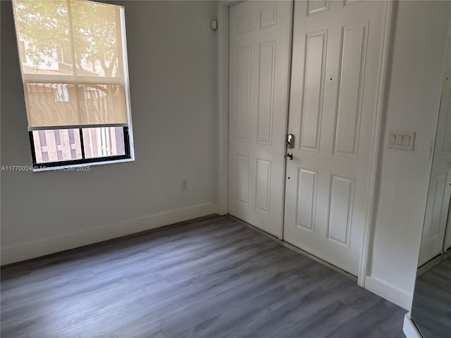10086 NW 89th Ter, Doral, FL 33178 - entryway featuring baseboards and wood finished floors