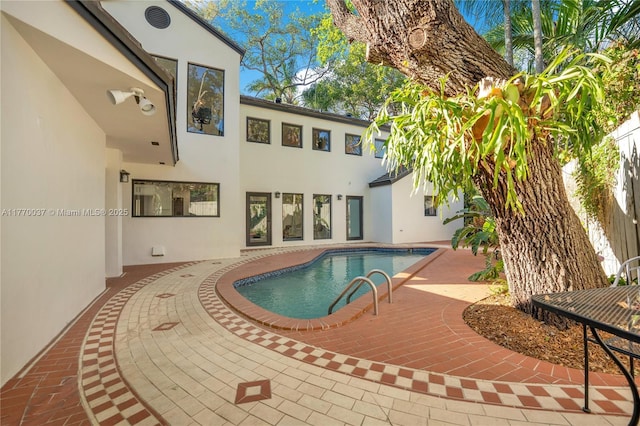 outdoor pool with a patio