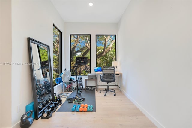 home office with recessed lighting, baseboards, and wood finished floors