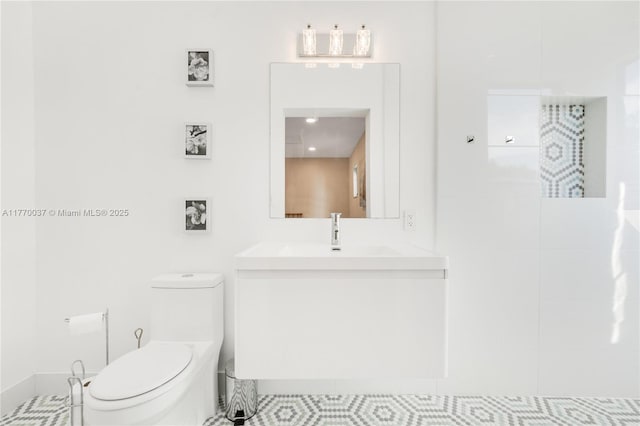 full bath with toilet and vanity