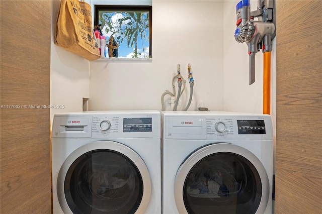 washroom featuring washing machine and dryer and laundry area