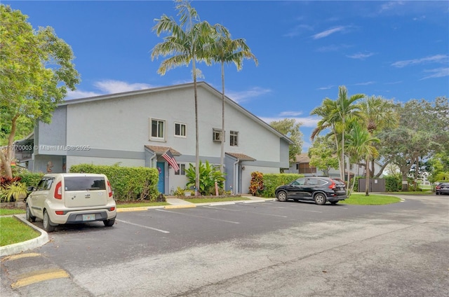 2761 S Oakland Forest Dr Unit 201, Oakland Park, FL 33309 - view of building exterior with uncovered parking