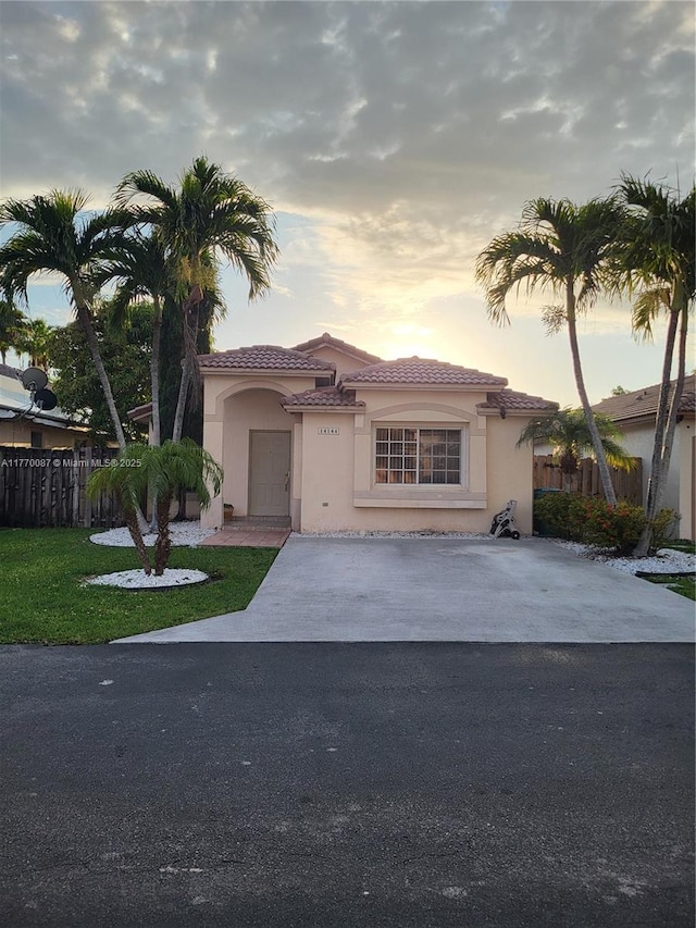 14144 SW 149th Pl, Miami, FL 33196 - mediterranean / spanish-style home featuring stucco siding, fence, and a tile roof