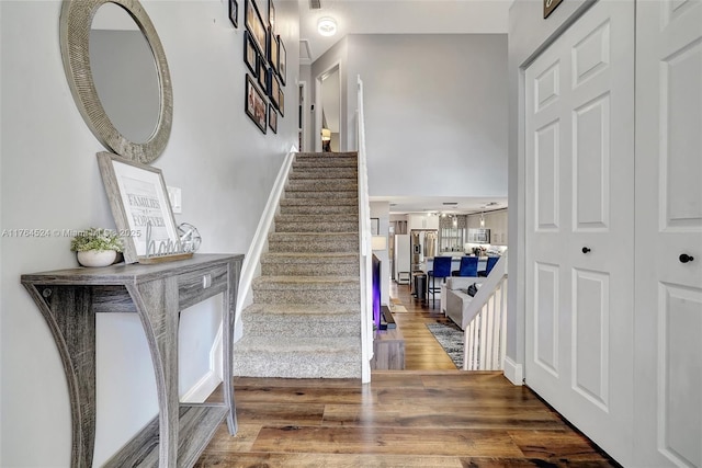 stairs with wood finished floors