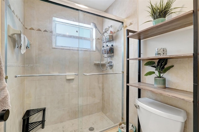 full bath with toilet and a stall shower
