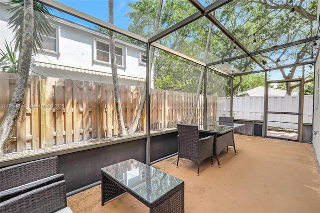 sunroom / solarium with outdoor dining area
