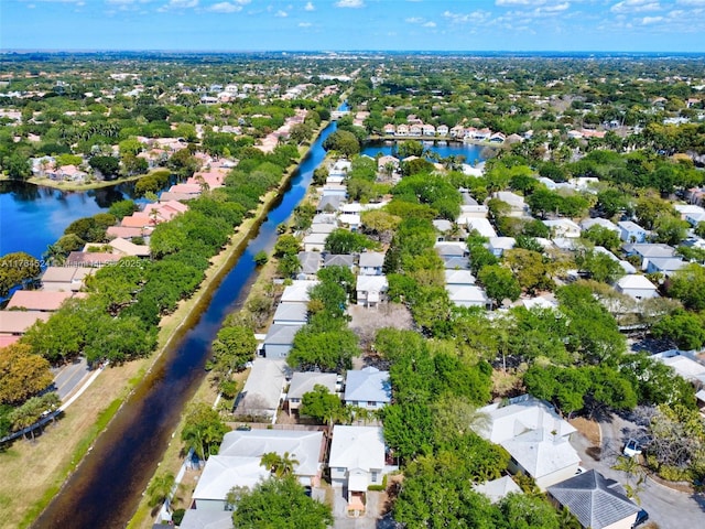 bird's eye view featuring a residential view and a water view