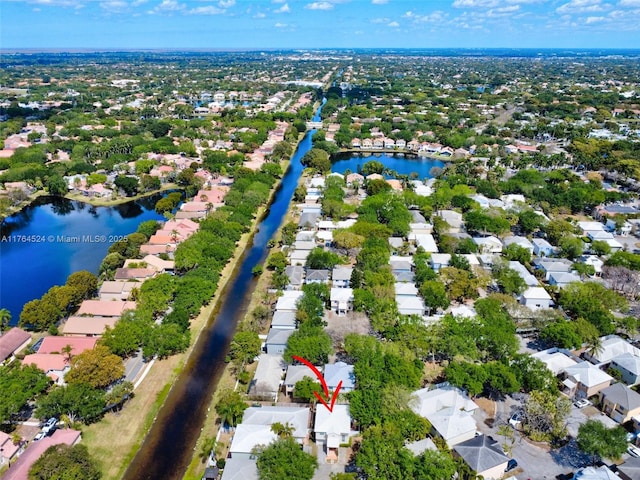 aerial view featuring a residential view and a water view