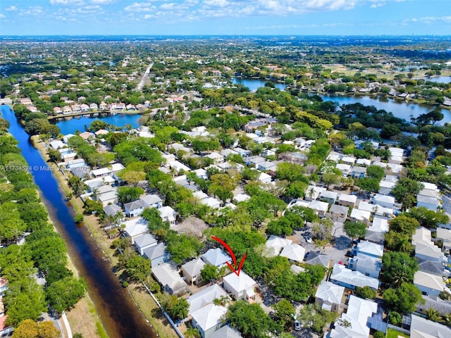 bird's eye view featuring a residential view and a water view