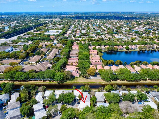 birds eye view of property with a residential view and a water view