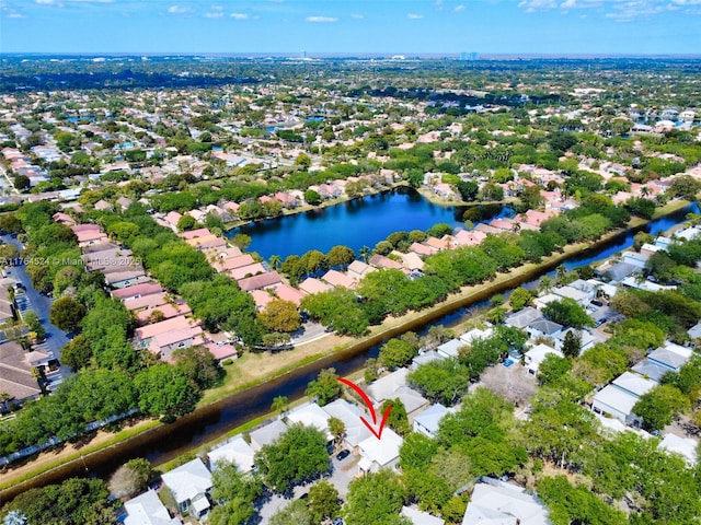 bird's eye view with a water view and a residential view