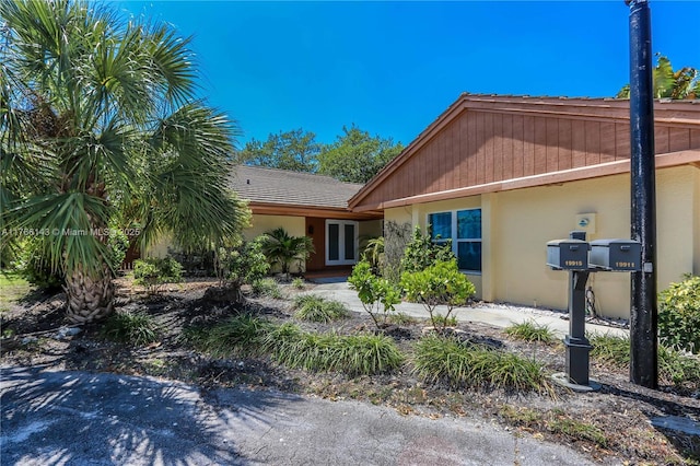 19915 NE 10th Place Way, Miami, FL 33179 - view of front of home featuring stucco siding and french doors
