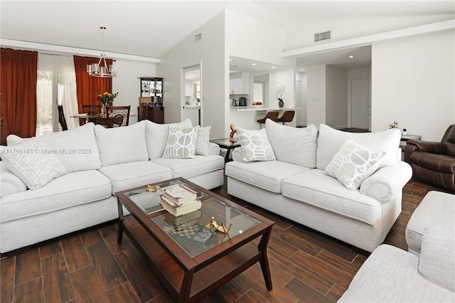 19915 NE 10th Place Way, Miami, FL 33179 - living room featuring lofted ceiling, a chandelier, wood finished floors, and recessed lighting