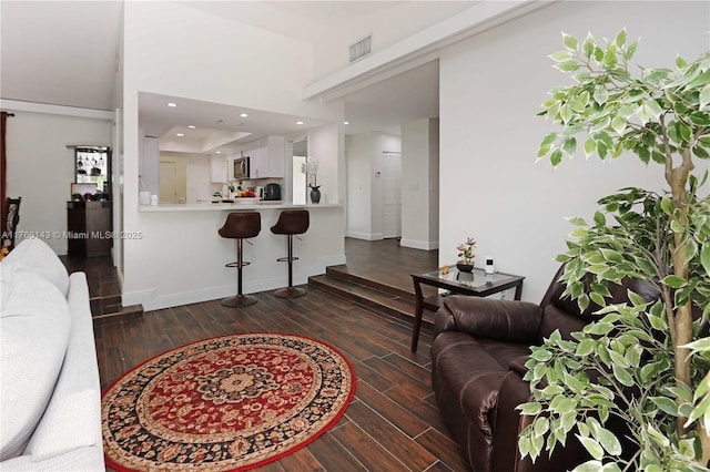 19915 NE 10th Place Way, Miami, FL 33179 - living room with dark wood-style flooring, baseboards, and recessed lighting