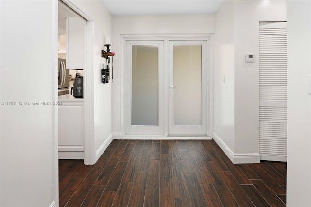 19915 NE 10th Place Way, Miami, FL 33179 - foyer featuring dark wood-type flooring and baseboards