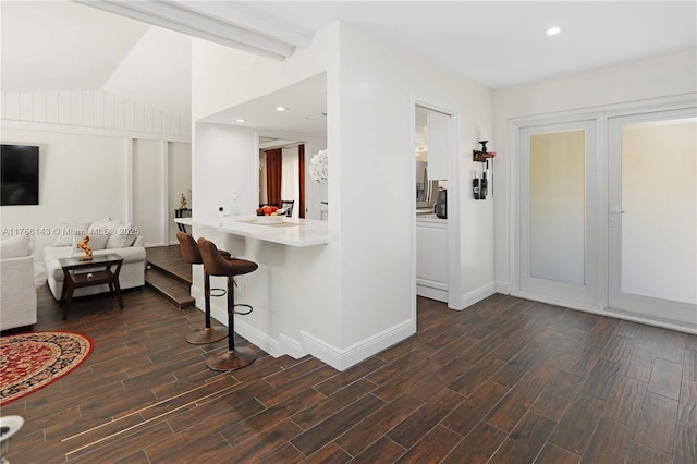 19915 NE 10th Place Way, Miami, FL 33179 - living room featuring dark wood-style floors, lofted ceiling, baseboards, and recessed lighting