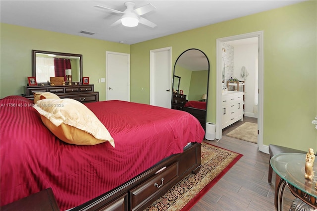 19915 NE 10th Place Way, Miami, FL 33179 - bedroom featuring dark wood-style floors, ensuite bathroom, a ceiling fan, and baseboards