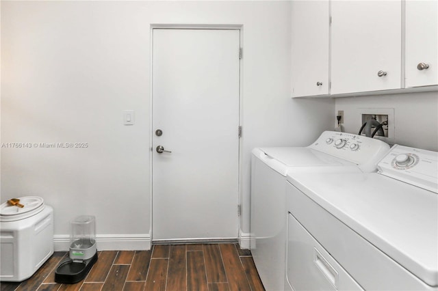 19915 NE 10th Place Way, Miami, FL 33179 - laundry area featuring separate washer and dryer, wood finished floors, cabinet space, and baseboards