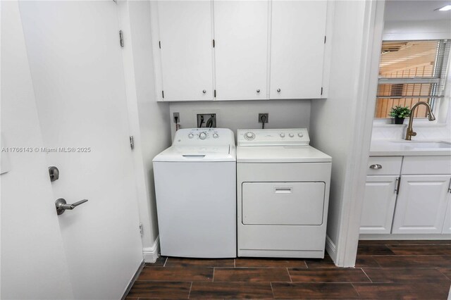 19915 NE 10th Place Way, Miami, FL 33179 - laundry area with washing machine and dryer, cabinet space, wood finish floors, and baseboards