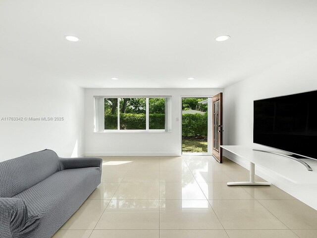 9457 Carlyle Ave, Surfside, FL 33154 - living area with plenty of natural light, tile patterned floors, and recessed lighting