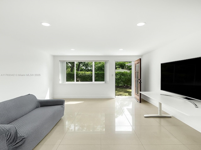 living area with tile patterned floors, recessed lighting, and a wealth of natural light