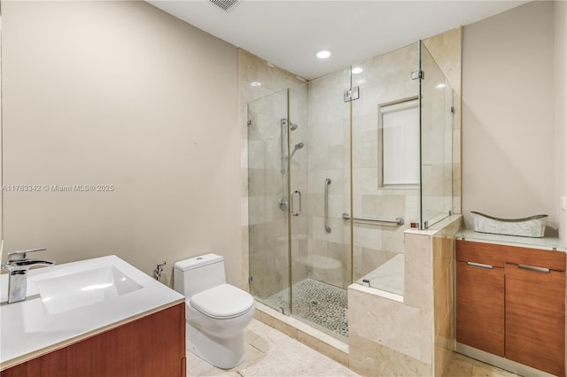 bathroom with vanity, tile patterned flooring, toilet, recessed lighting, and a stall shower