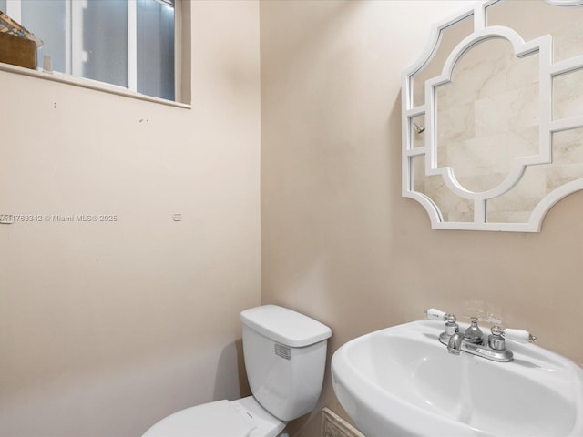 bathroom with a sink and toilet