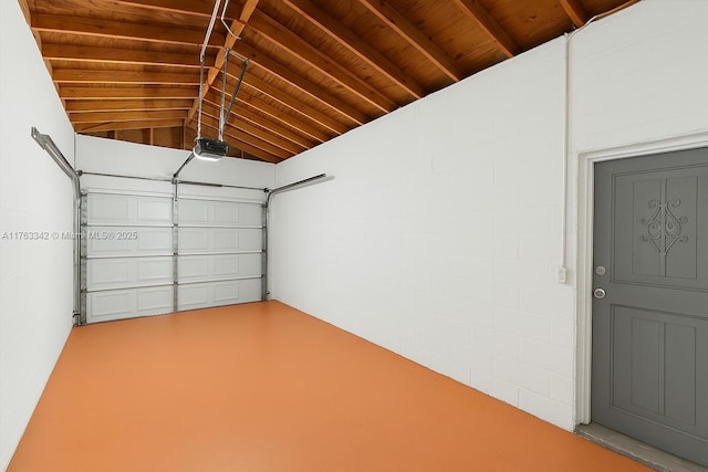 garage with wooden ceiling and a garage door opener