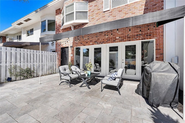 8 Hathaway Ln, Wilton Manors, FL 33305 - view of patio / terrace featuring french doors and outdoor lounge area