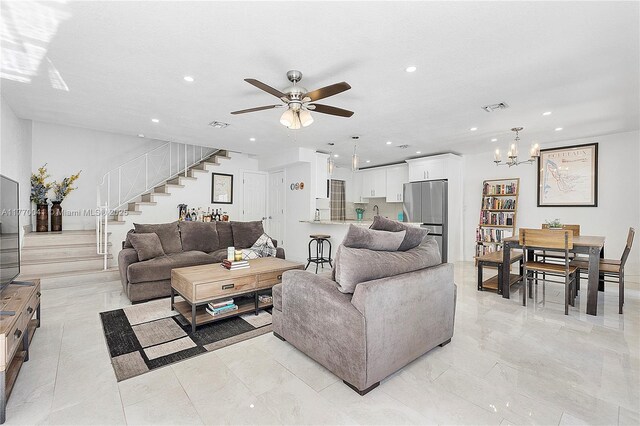 8 Hathaway Ln, Wilton Manors, FL 33305 - living area featuring stairway, a ceiling fan, recessed lighting, a chandelier, and light marble finish floors
