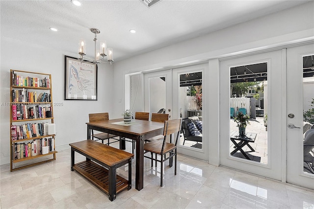dining room with french doors, recessed lighting, a chandelier, and a textured ceiling